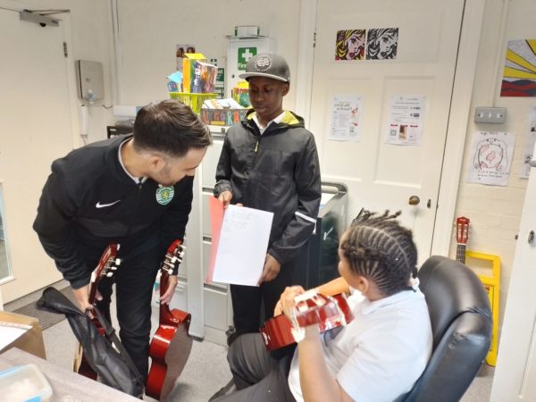 Learners from TLC SEND school in Bromley crafting their own songs with their Music Tutor Ismael.