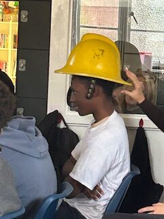 Learners at TLC explore London Fire Brigade history with Paul Jennings, learning what it takes to be a firefighter.