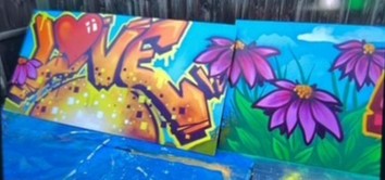 Spray-painted boards created by learners, soon to be installed in the playground to brighten TLC’s outdoor space.