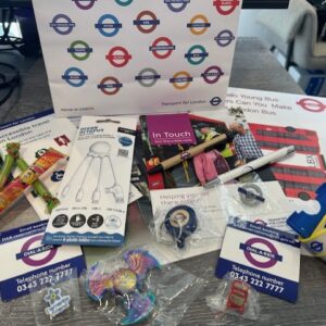 Learners at TLC The Learning Centre exploring careers through a Dial-a-Ride London work experience, showcasing Transport for London resources including official bags and lanyards.