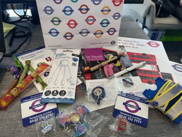 Learners at TLC The Learning Centre exploring careers through a Dial-a-Ride London work experience, showcasing Transport for London resources including official bags and lanyards.