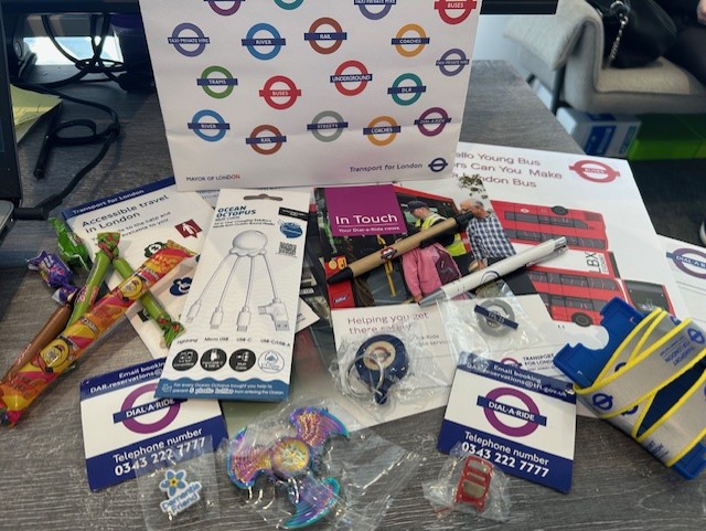 Learners at TLC The Learning Centre exploring careers through a Dial-a-Ride London work experience, showcasing Transport for London resources including official bags and lanyards.