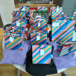 Year 11 and Year 12 learners celebrate the end of their GCSE journey at TLC School, receiving leavers' hoodies and recognising their achievements alongside families and staff.